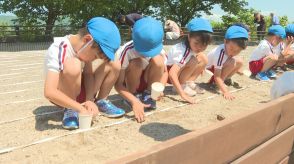 夏に向けた準備　瀬戸内海を望む景観の場所で園児がひまわりの種まき　山口・下松